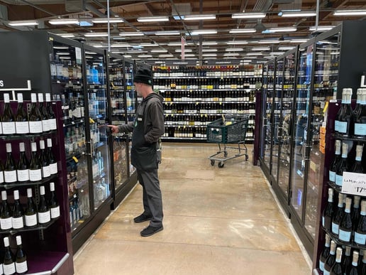 Shopper unlocking an Indyme Freedom Case in a store aisle"